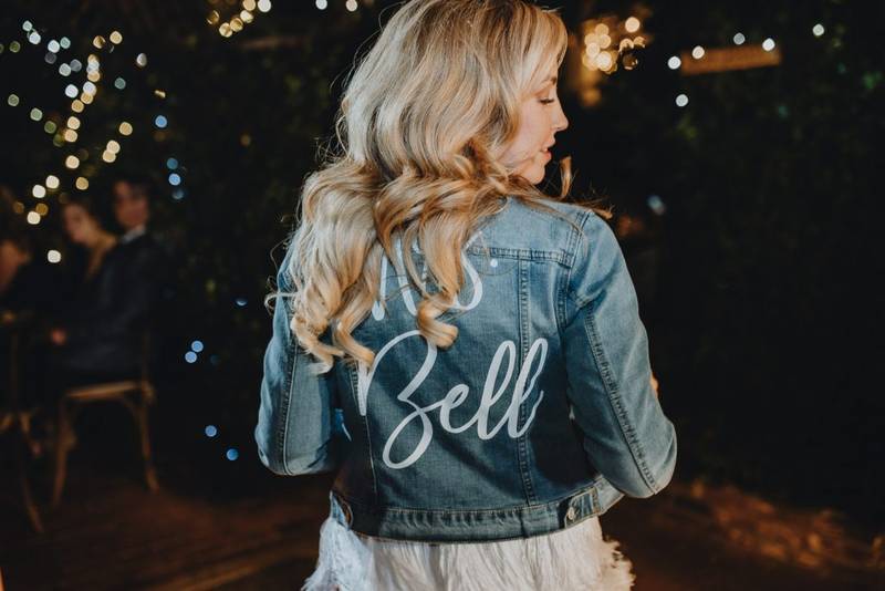 Bride with denim jacket at los angeles wedding
