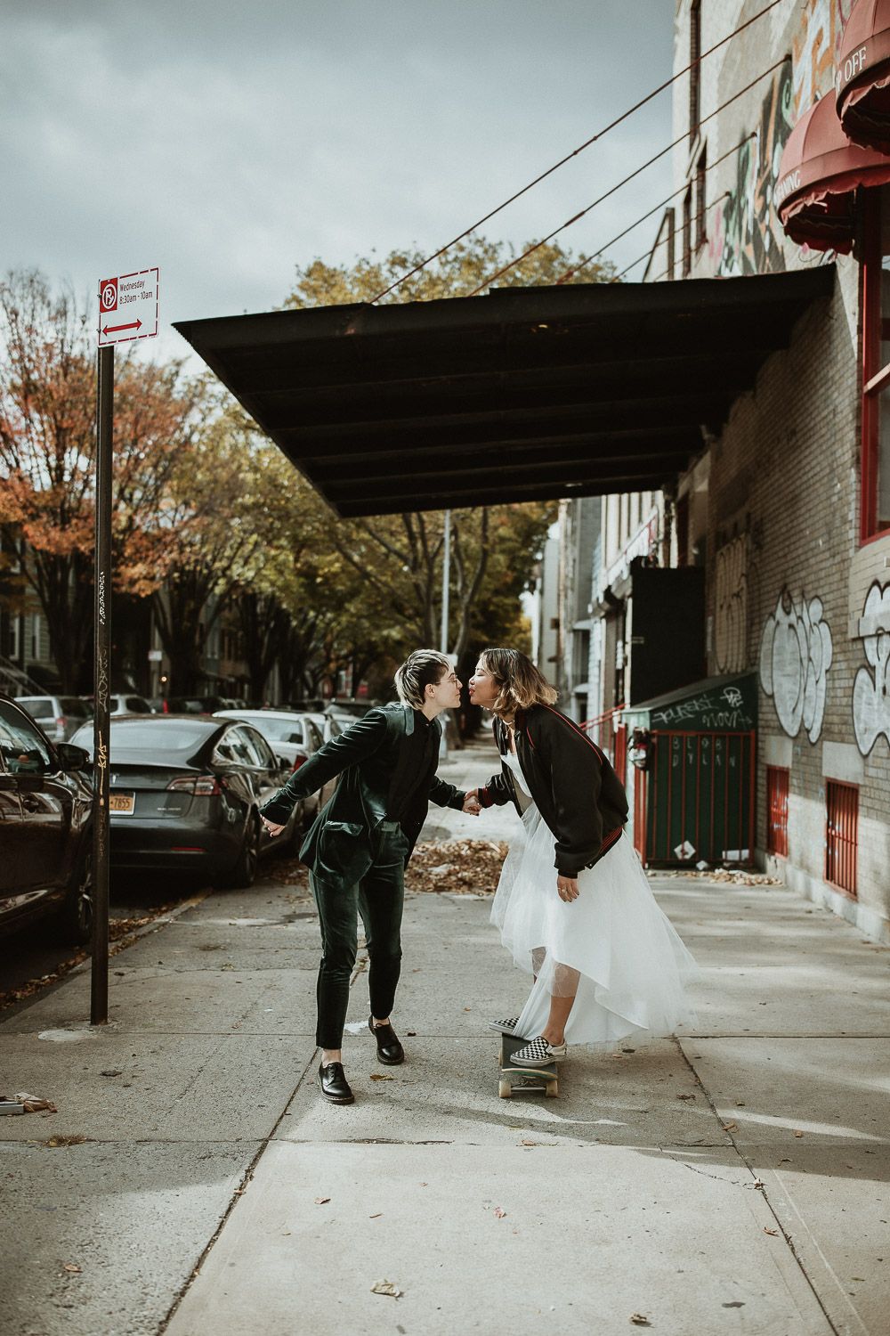 LGBTQ couple rides skateboard during brooklyn elopement