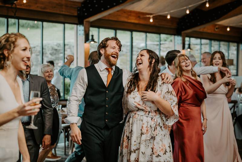 Groom at red maple vineyard wedding reception
