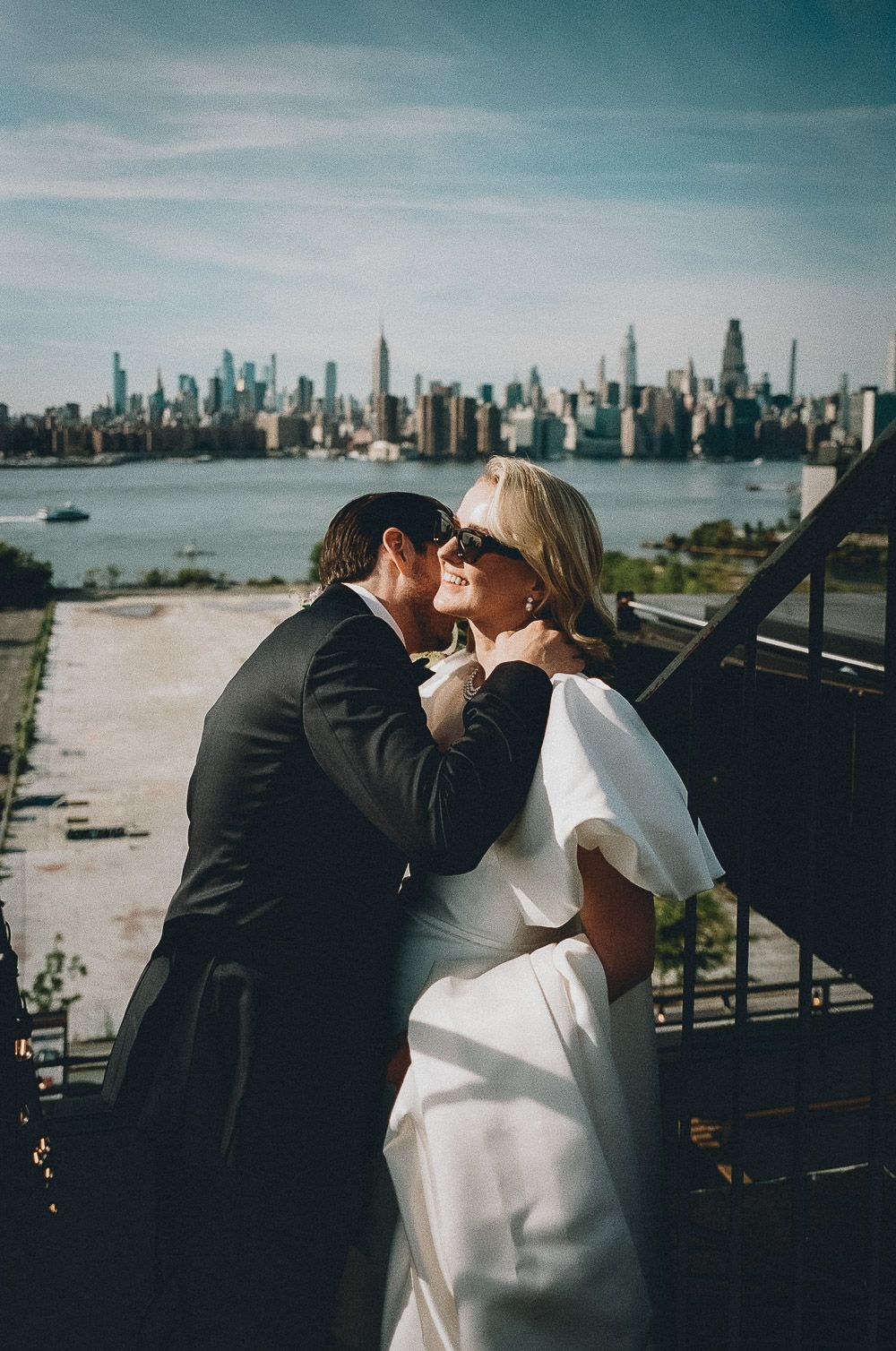Film photo of bride and groom on brooklyn rooftop