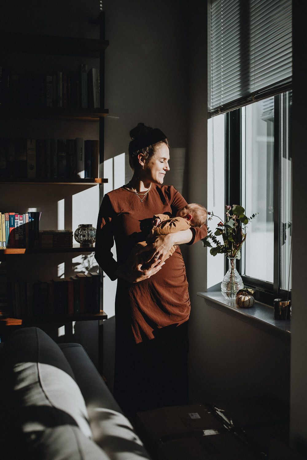 Mother and son during in home newborn photoshoot in nyc