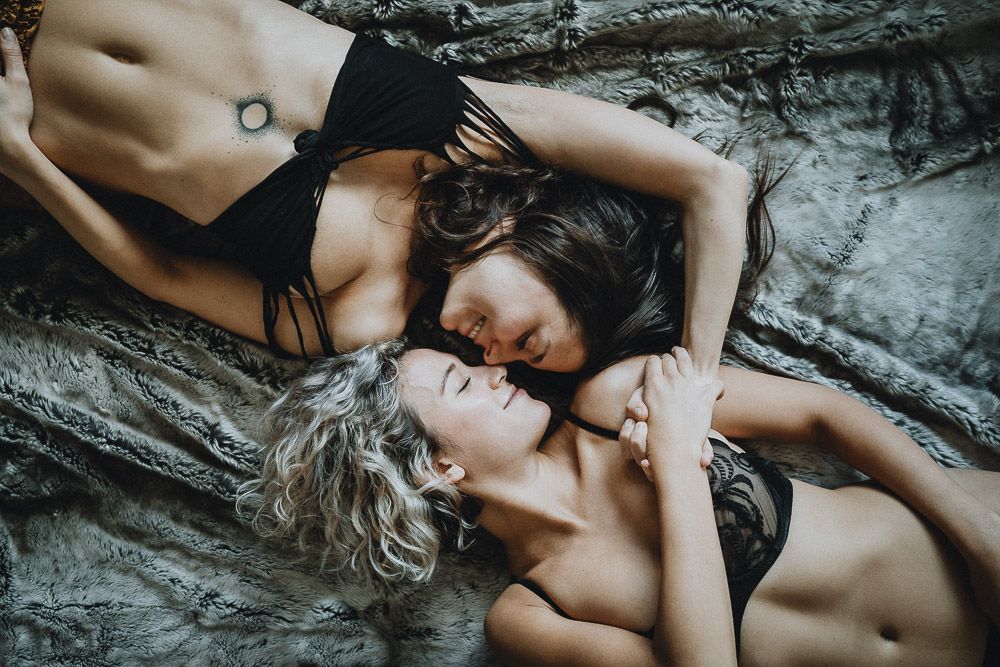 Lesbian couple snuggling in lingerie during couple session in brooklyn