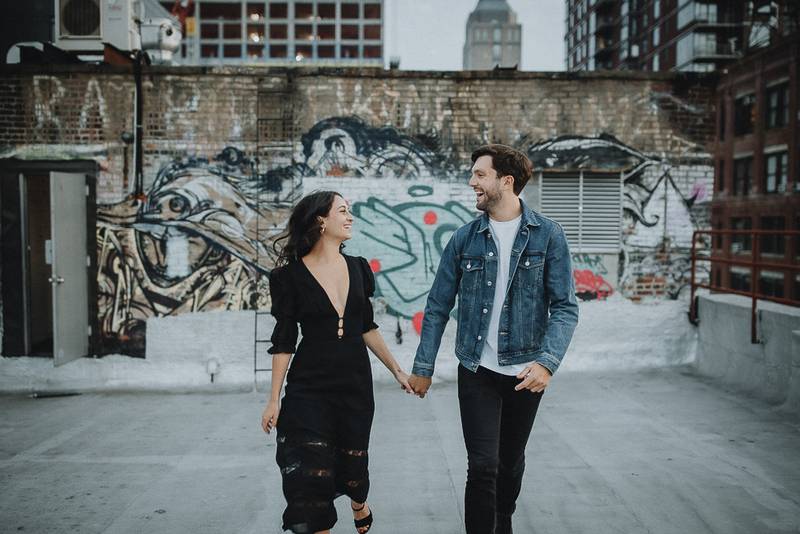 Couple on dumbo rooftop during brooklyn engagement session
