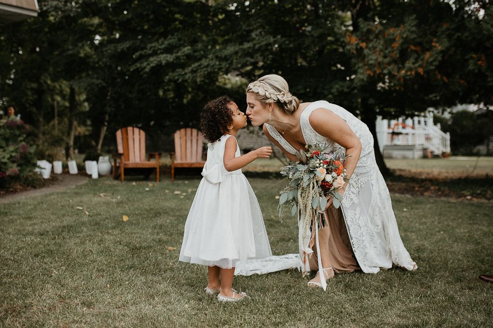 Flower girl and bride at fall backyard wedding in new jersey