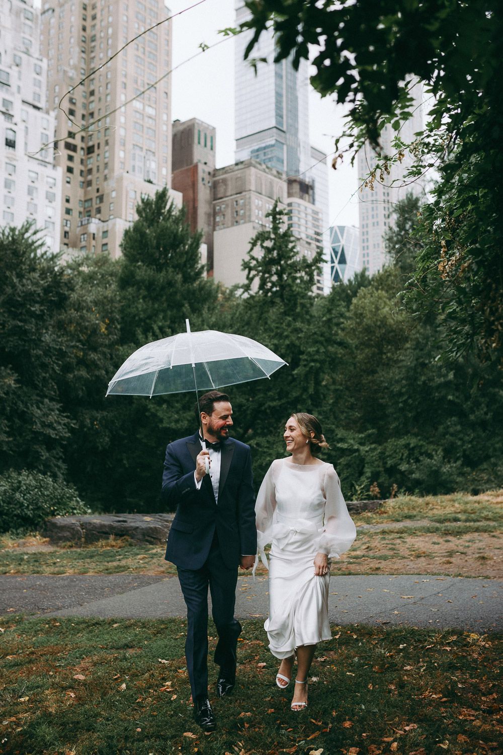 Bride and groom during rainy fall elopement in central park