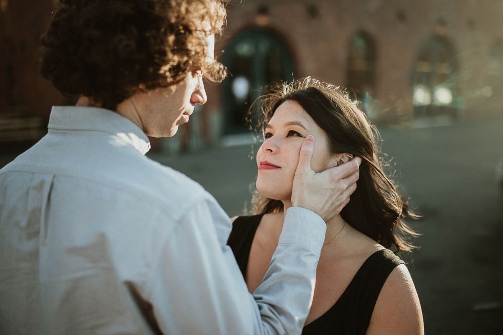 Couple during engagement photoshoot in dumbo brooklyn at golden hour
