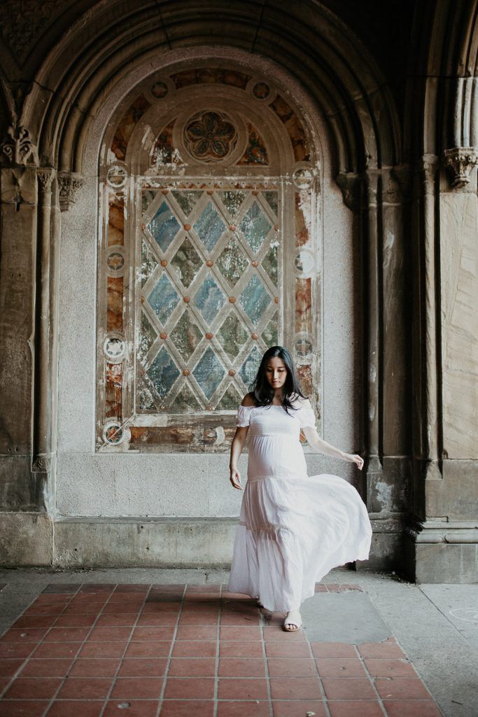 Pregnant woman in central park at bethesda terrace during maternity photoshoot