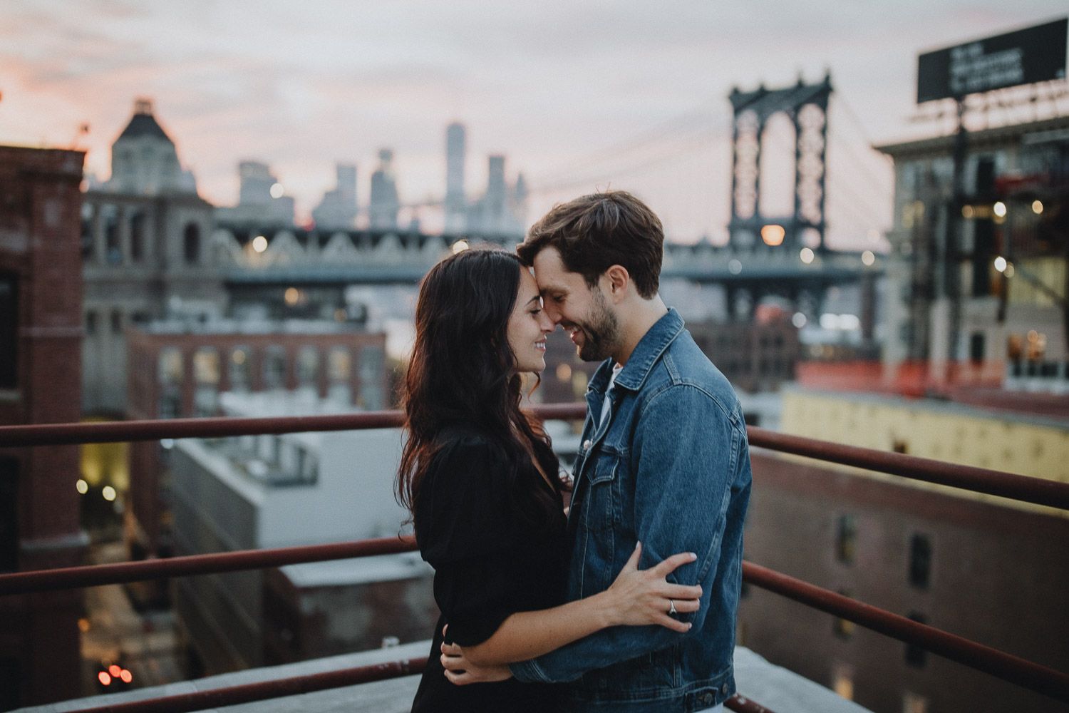 Couple on dumbo rooftop during brooklyn engagement session