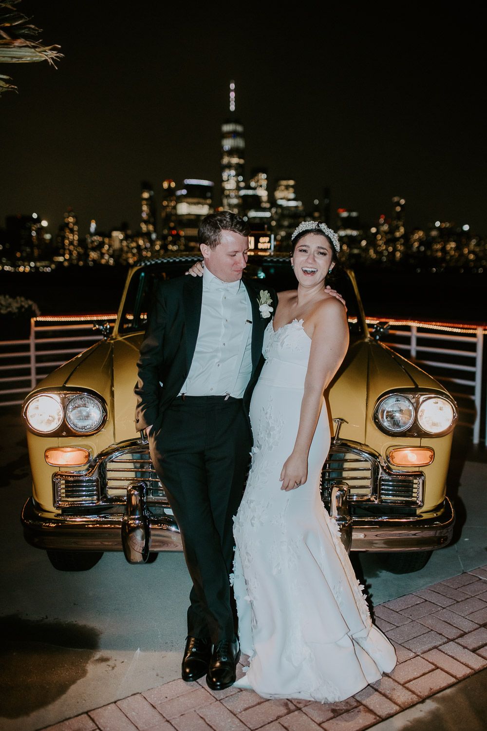 Bride and groom at night wedding by nyc vintage yellow cab