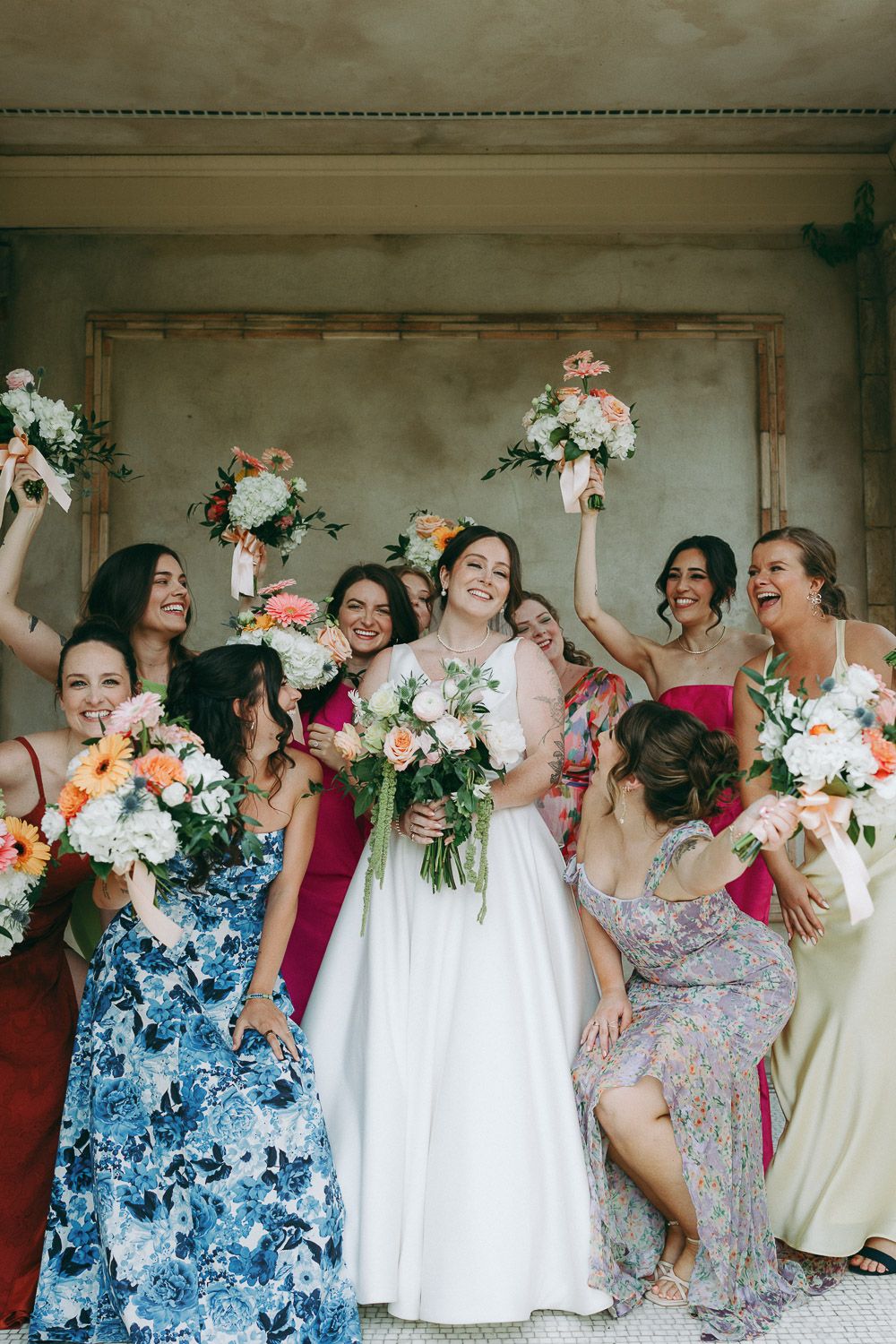 Colorful mismatched bridesmaids at tuscany italy wedding