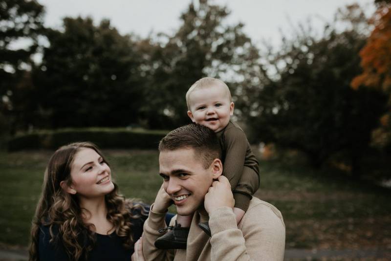 Parents and baby during fall family session in west point