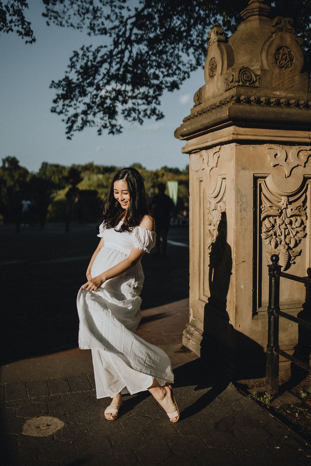 Pregnant woman in central park at bethesda terrace during maternity photoshoot