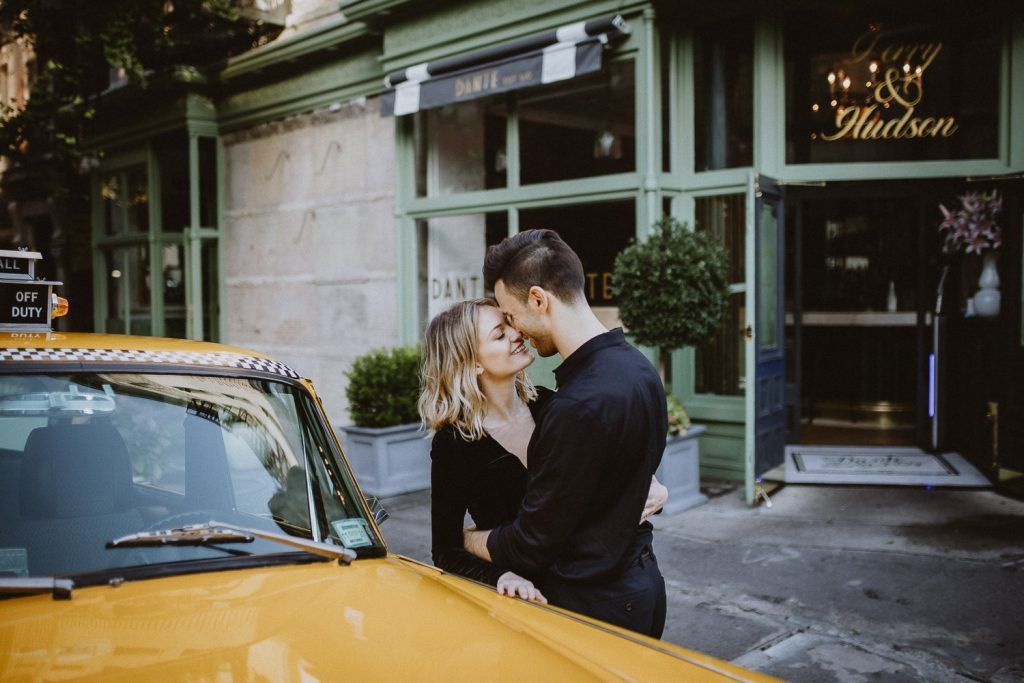 Couple in vintage nyc cab for engagement photoshoot