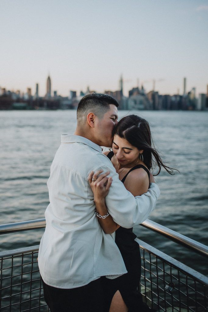 Couple during engagement photo session in williamsburg brooklyn