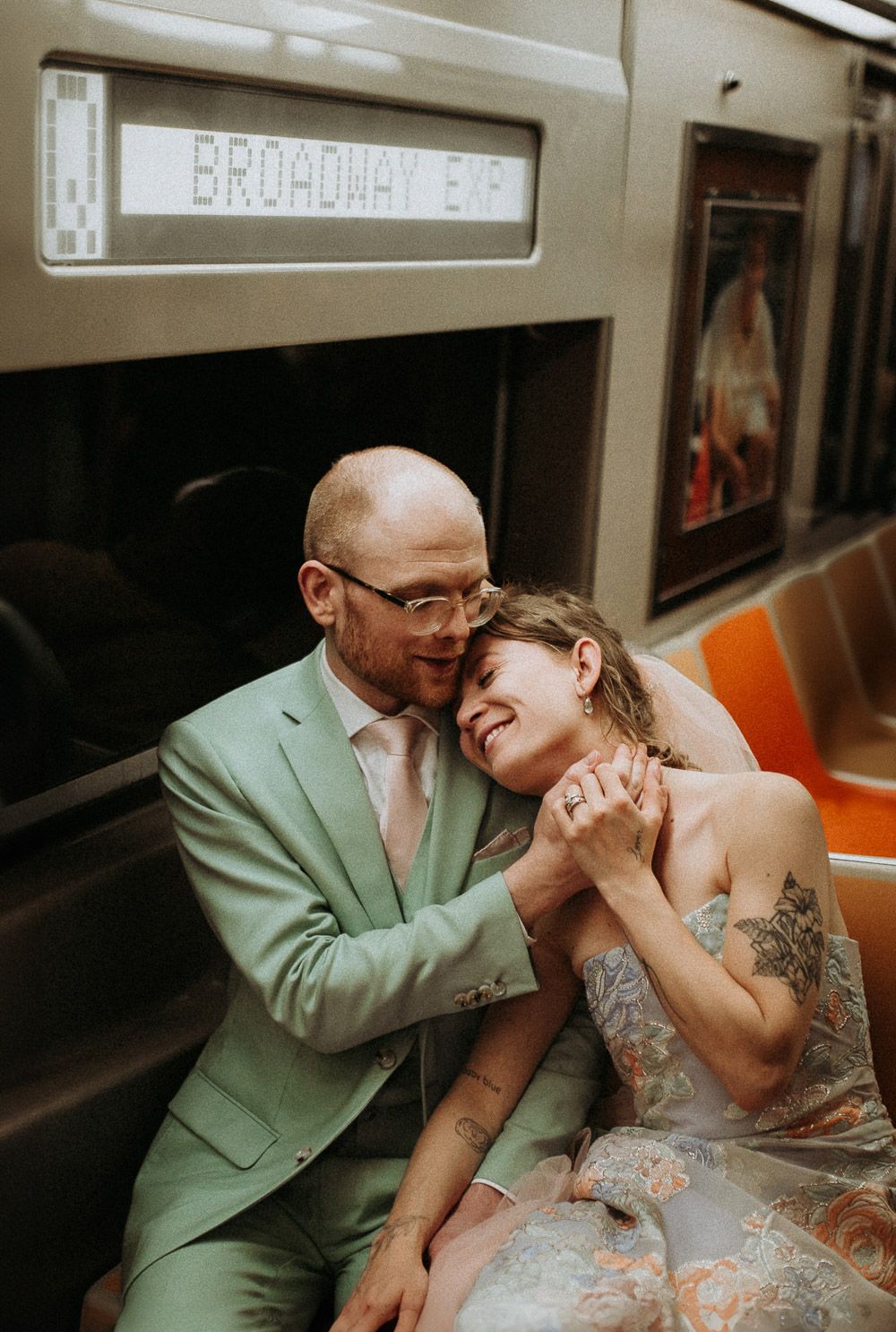 Bride and groom in nyc subway - by Lucie B. Photo brooklyn wedding photographer