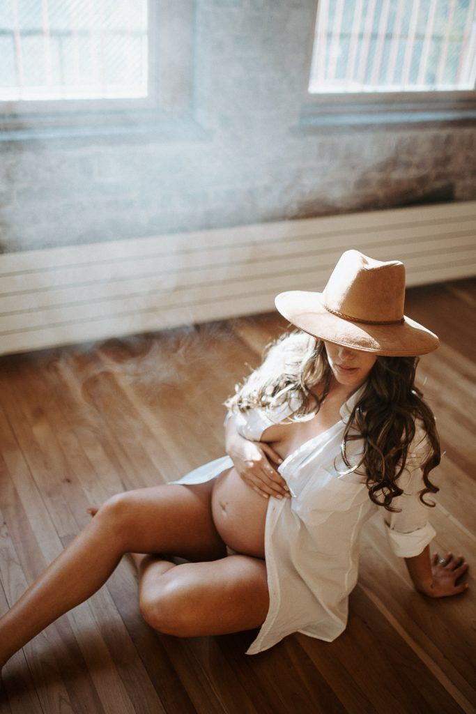 Naked pregnant woman during maternity session in nyc home