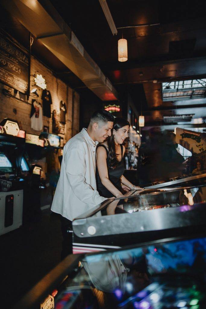 Couple during engagement photo session at bar in williamsburg