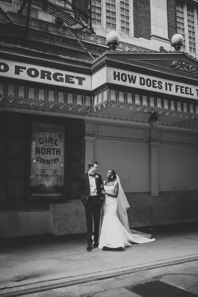 Interracial bride and groom at nyc wedding in theatre district