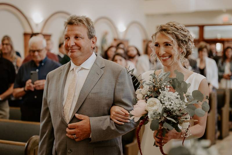 Bride walks down the aisle at hudson valley wedding ceremony