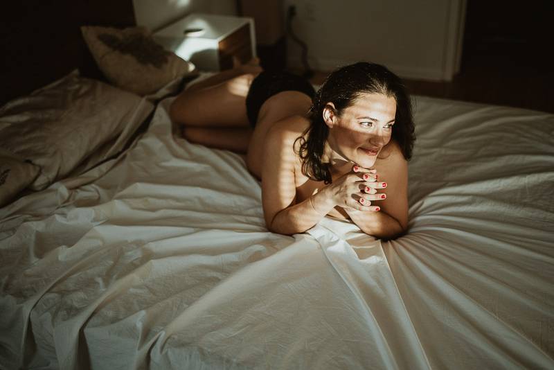 Naked pregnant woman during maternity photoshoot at home in brooklyn