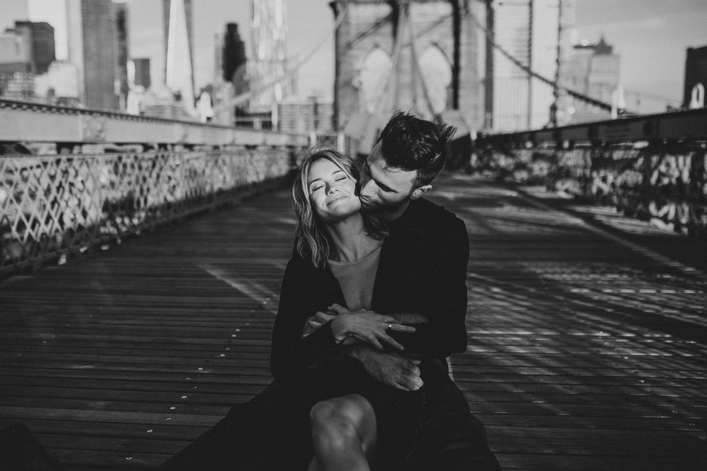 Couple on brooklyn bridge at sunrise during elopement photoshoot