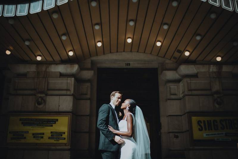 Interracial bride and groom at nyc wedding in theatre district