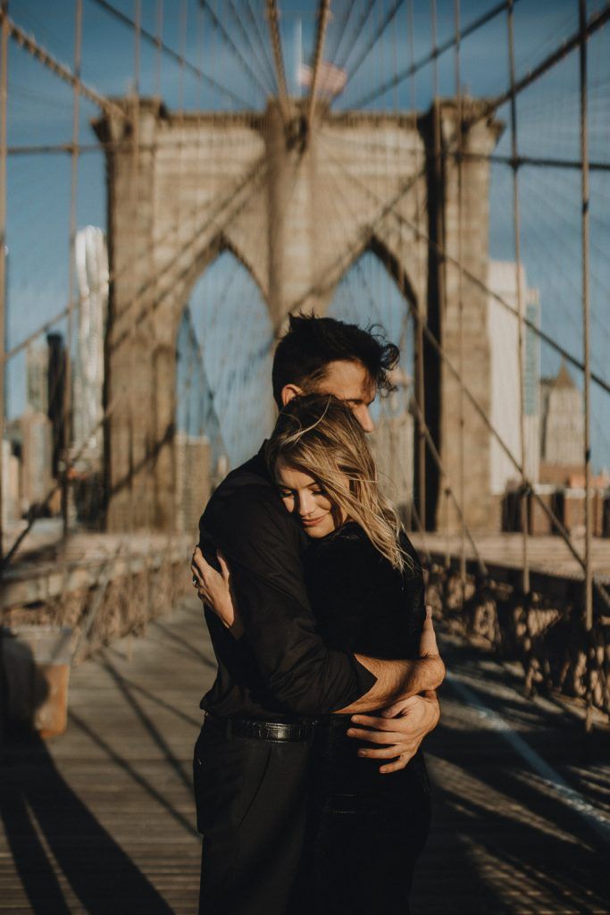 Couple on brooklyn bridge at sunrise during elopement photoshoot