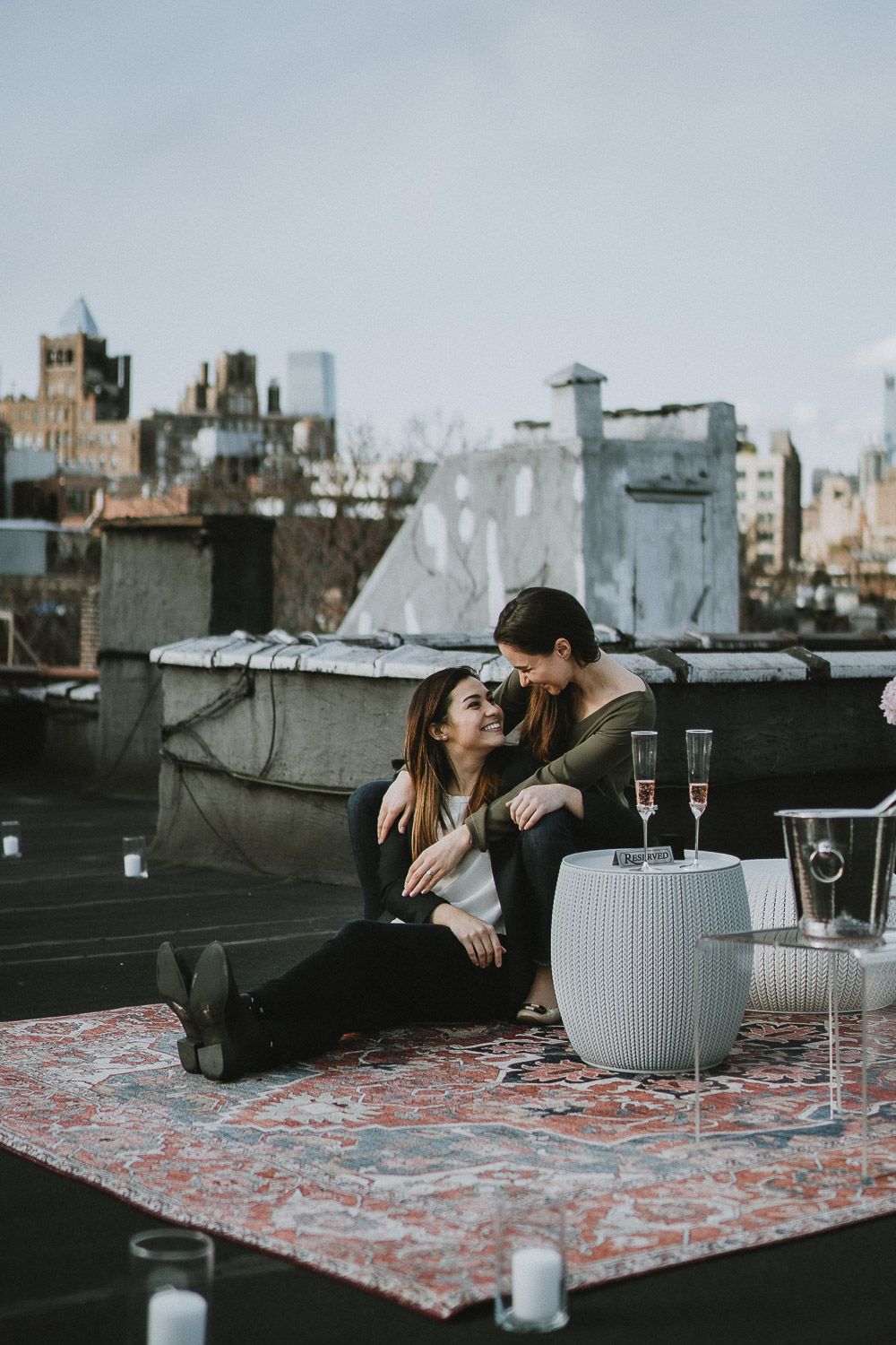 LGBTQ couple during engagement session on nyc rooftop