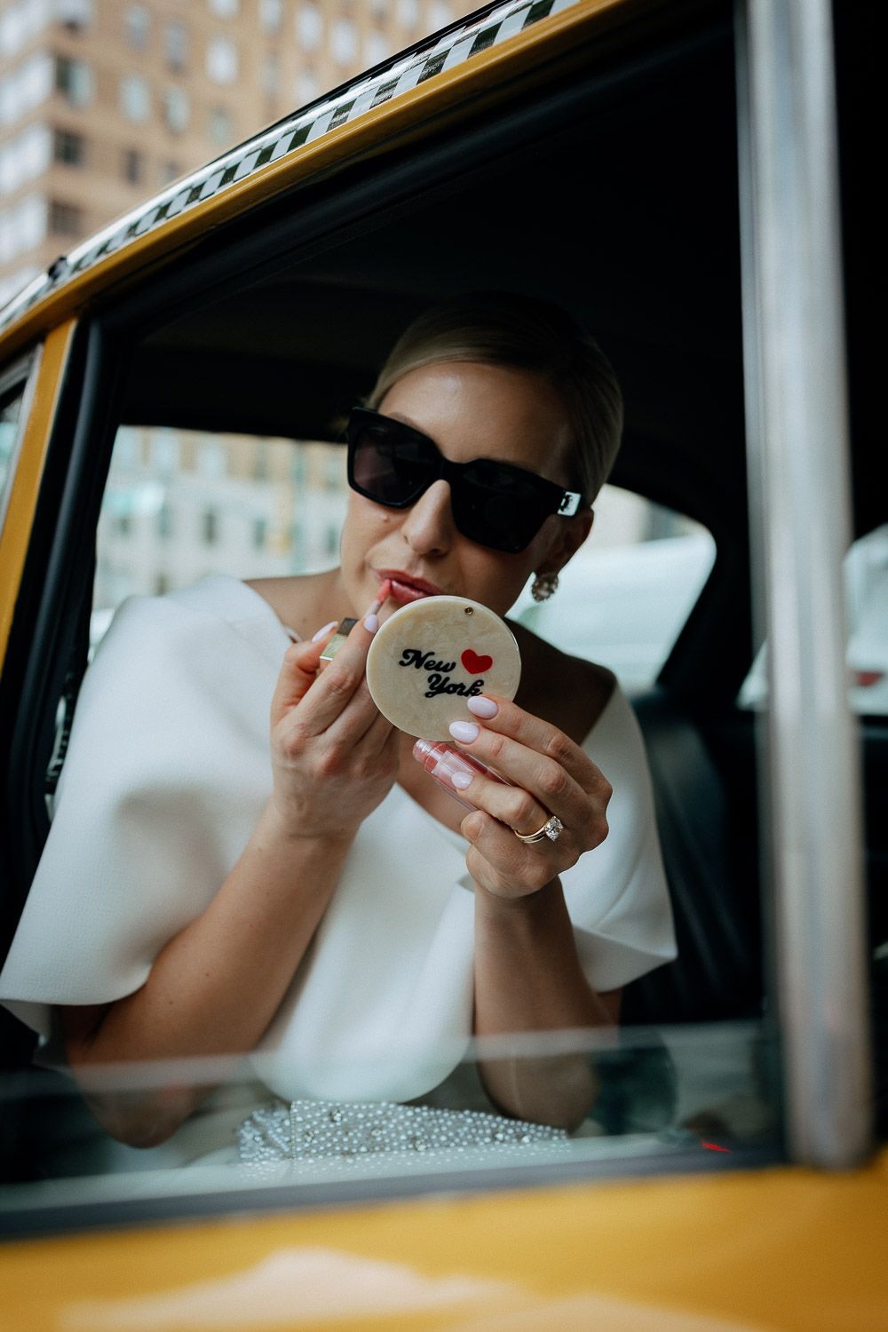 Bride portrait in nyc vintage taxi