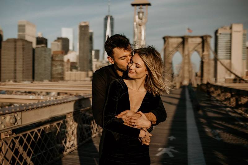 Couple on brooklyn bridge at sunrise during elopement photoshoot