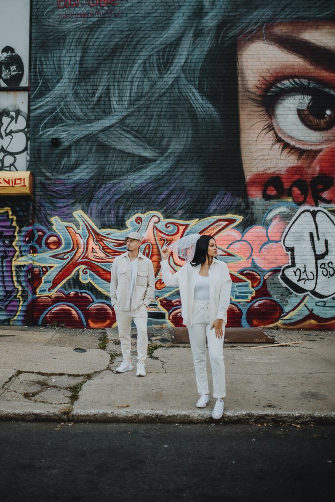 Couple during urban elopement in east williamsburg brooklyn