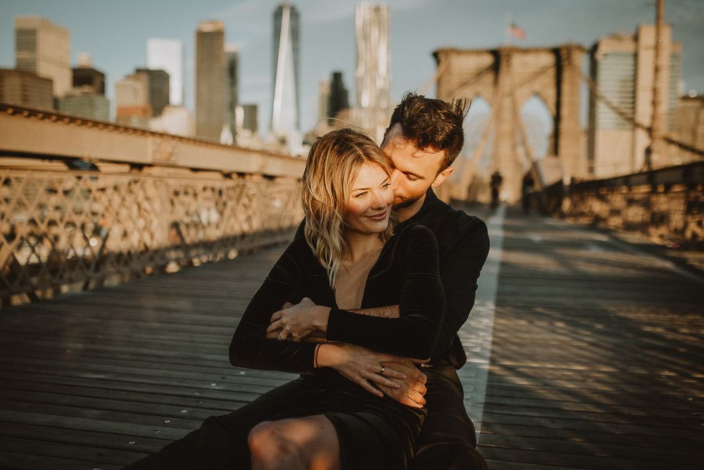 Couple on brooklyn bridge at sunrise during elopement photoshoot