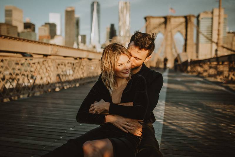 Couple on brooklyn bridge at sunrise during elopement photoshoot