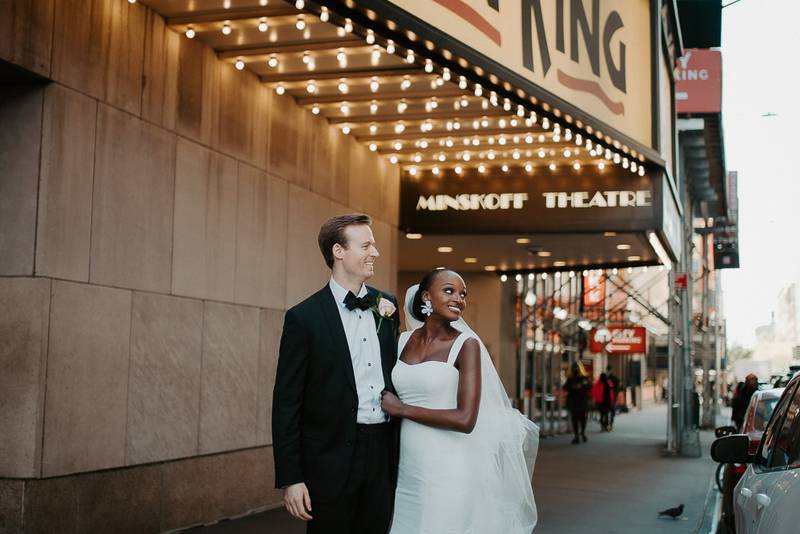 Interracial bride and groom at nyc wedding in theatre district