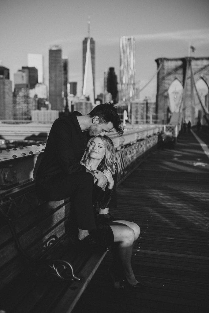 Couple on brooklyn bridge at sunrise during elopement photoshoot
