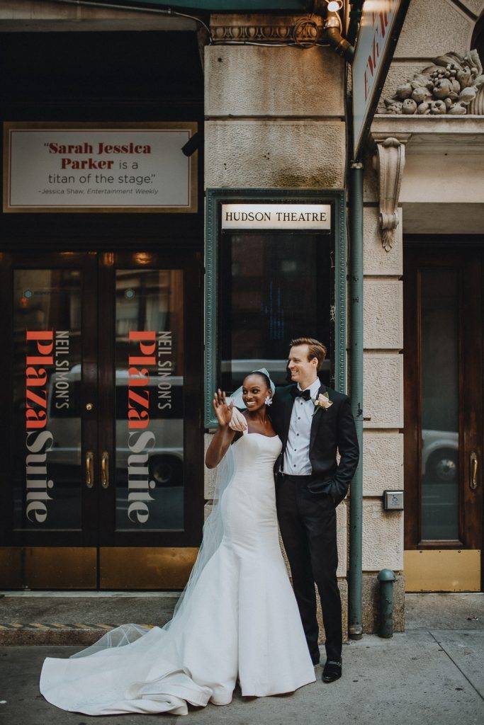 Interracial bride and groom at nyc wedding in theatre district