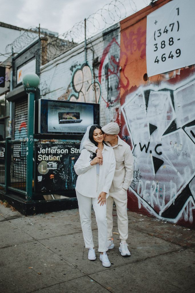Couple during urban elopement in east williamsburg brooklyn