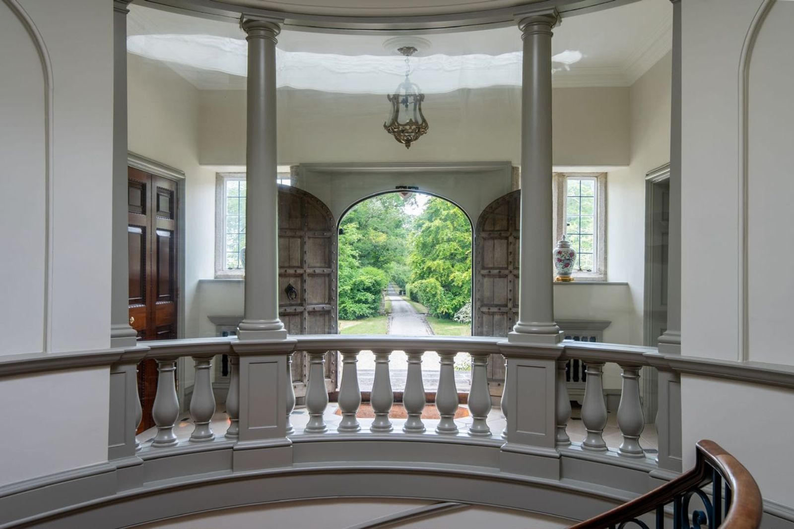 The stair hall seen from above, with columns and a balustrade