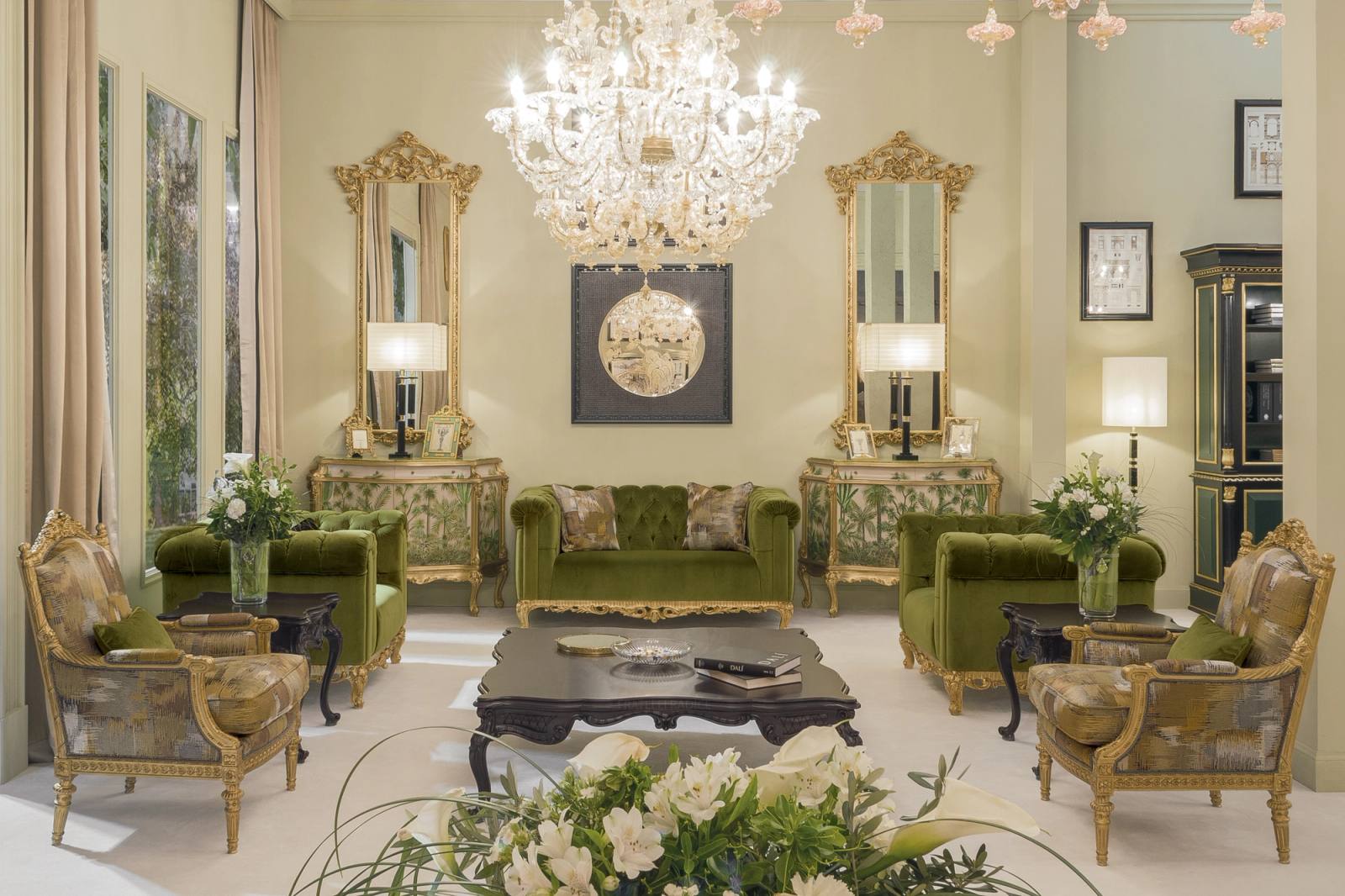 Salon of a classic Italian palazzo furnished by Fratelli Radice, with gilded mirror and console table, bordeaux damask walls and herringbone parquet
