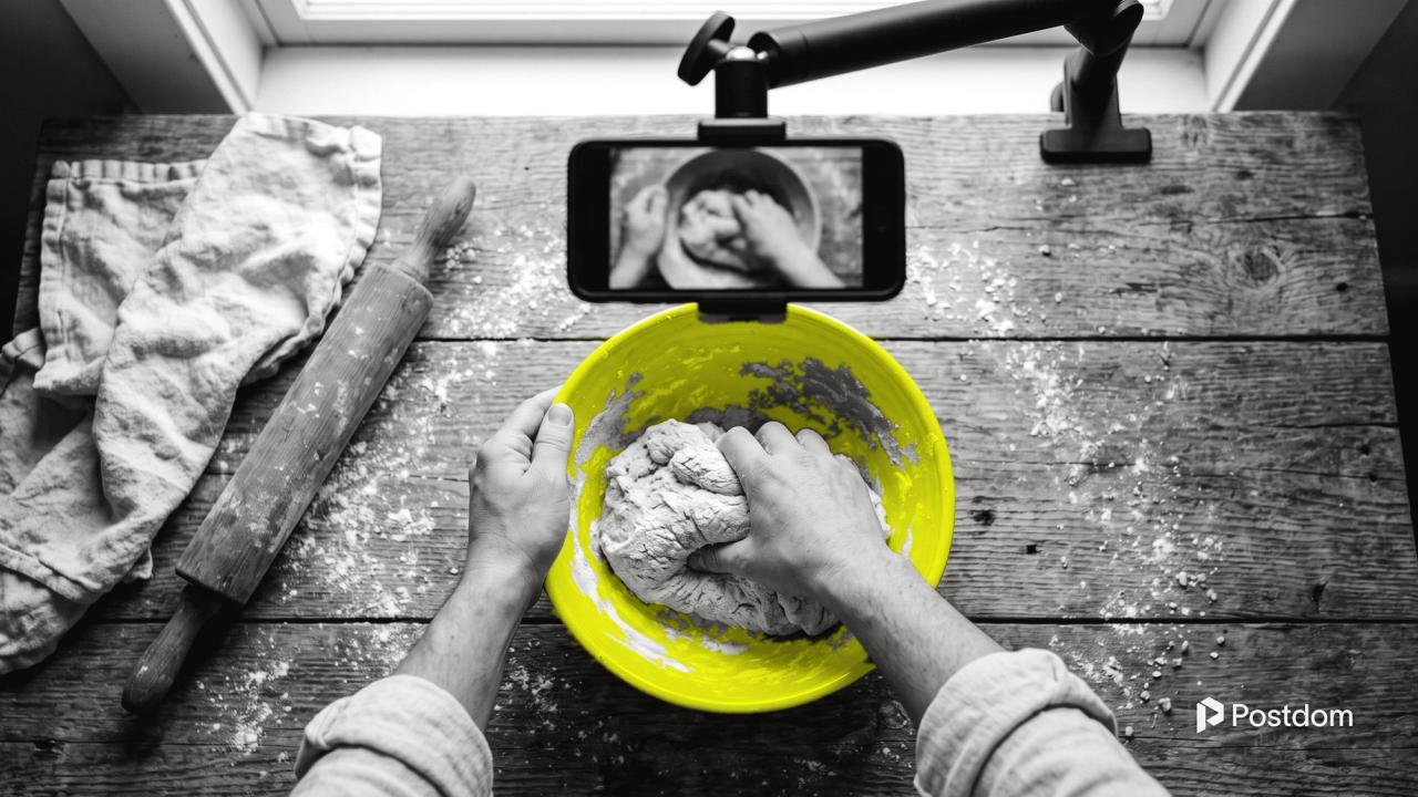 How to make faceless videos: an overhead phone mount films only a pair of hands kneading dough in a yellow bowl on a wooden table
