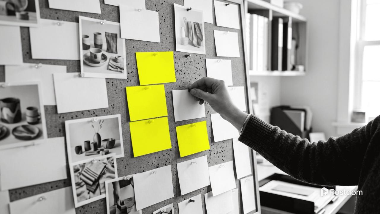 TikTok ideas: a cork board pinned with blank cards, product photos and yellow cards as a hand pins up one more card