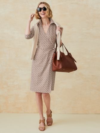 woman wearing tan geo pattern wrap dress