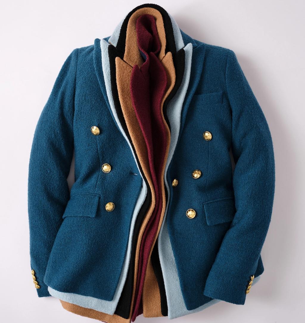 Teal blue blazer with gold buttons, revealing nested layers of light blue, black, tan, and maroon fabric.
