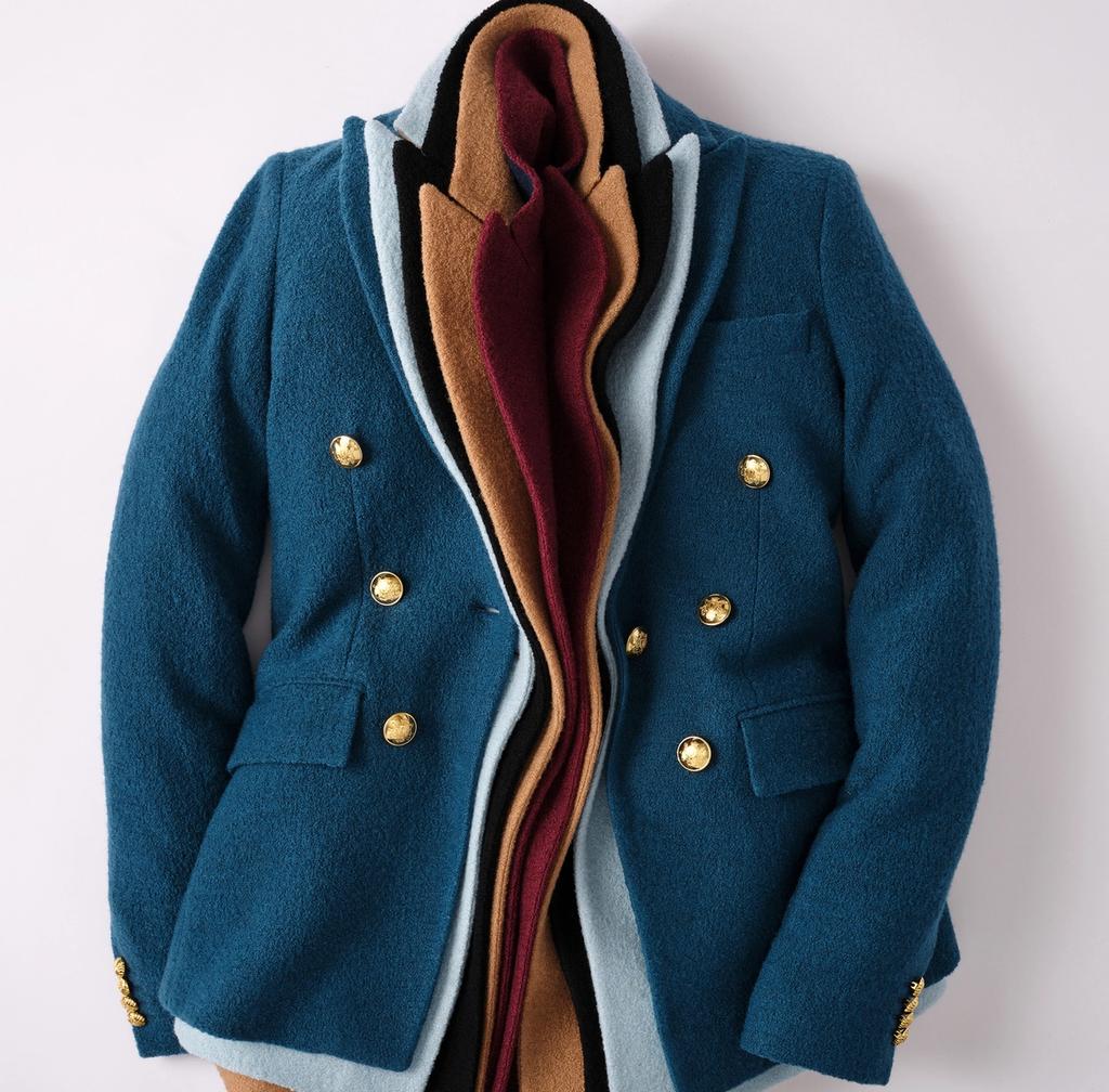 Teal blazer with golden buttons, revealing nested layers of blazers in light blue, black, camel, and burgundy.