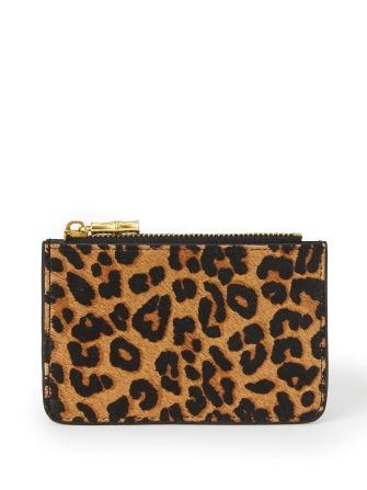 still life of womens leopard small zip credit card case
