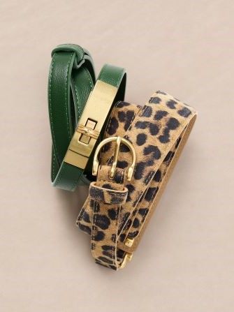 still life of womens leather belt and pony hair animal pattern belt