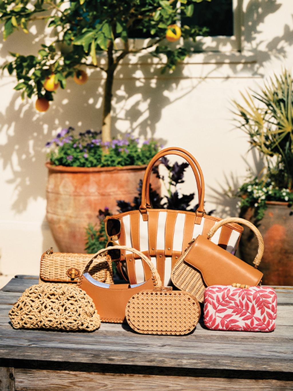 Assortment of handbags on a wooden table