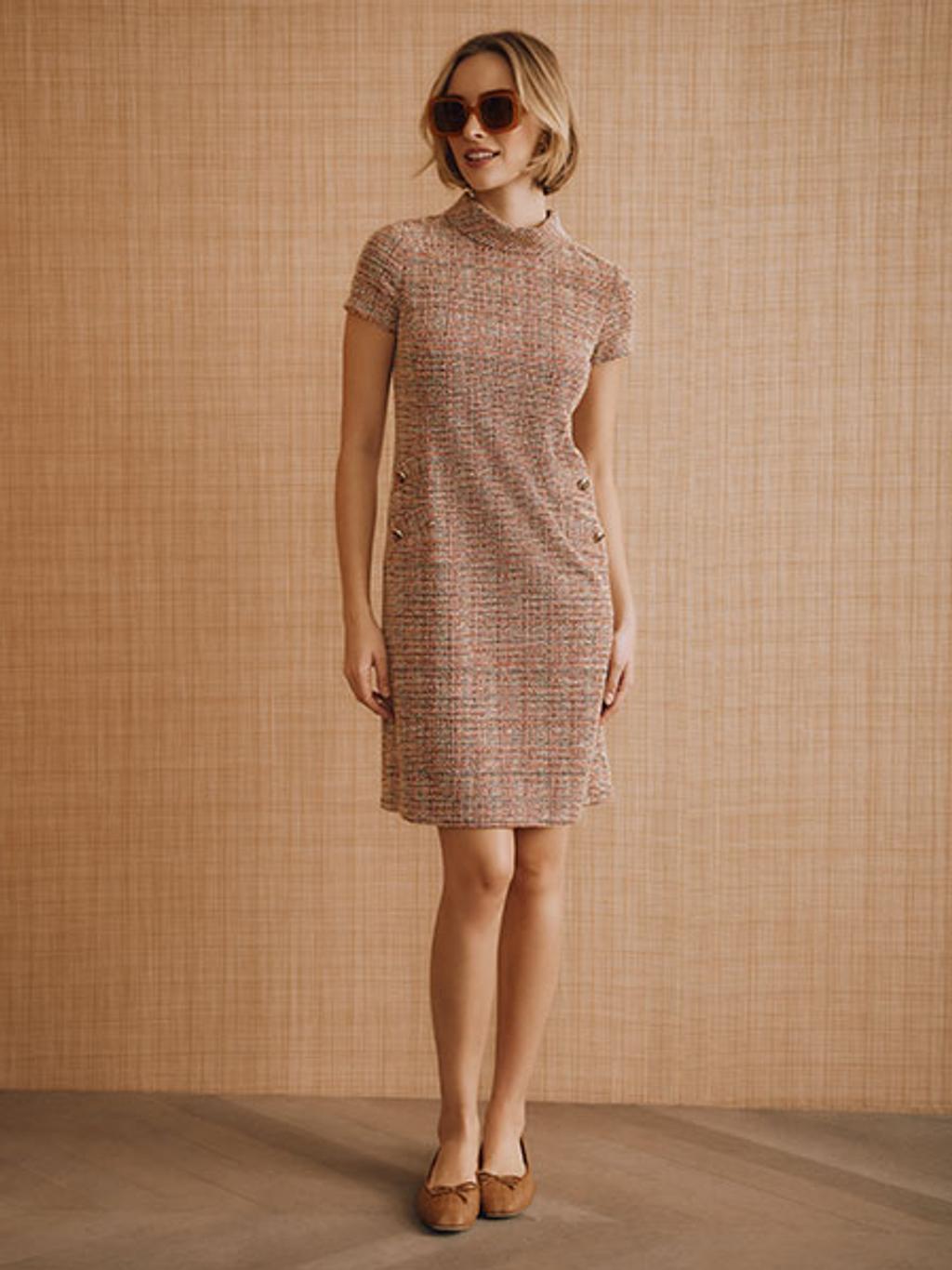 Model in tweed dress and ballet flats Model in tweed dress and ballet flats