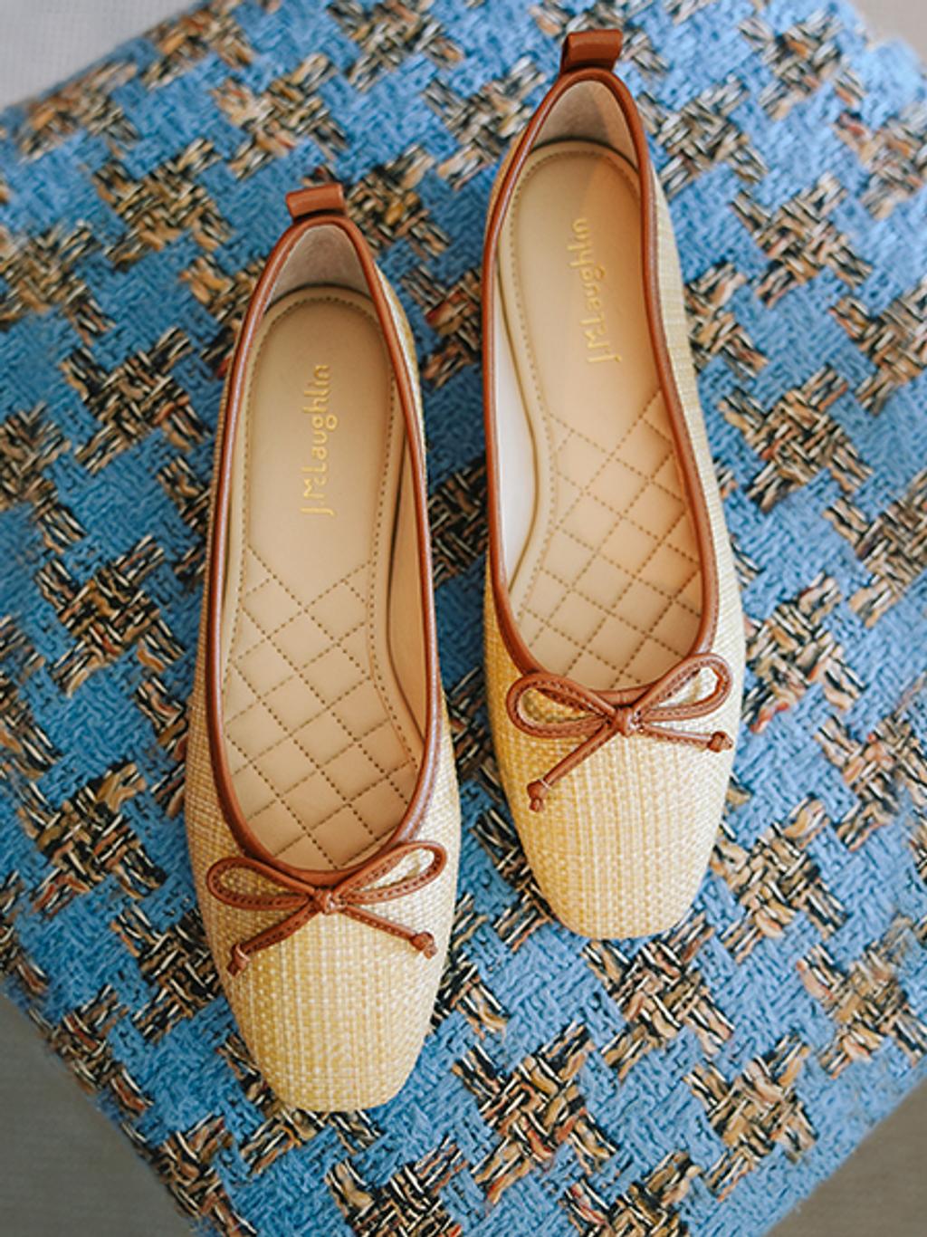 Raffia ballet flats with leather detailing.