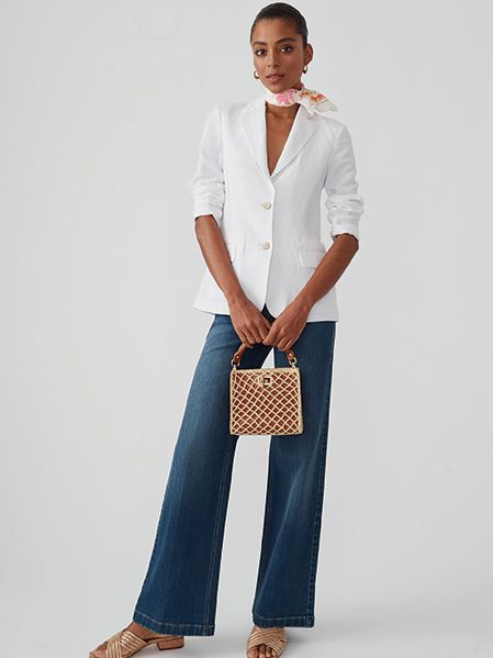 Model in white blazer and wide-leg jeans